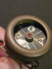 Marble’s Gladstone Michigan brass compass pin back