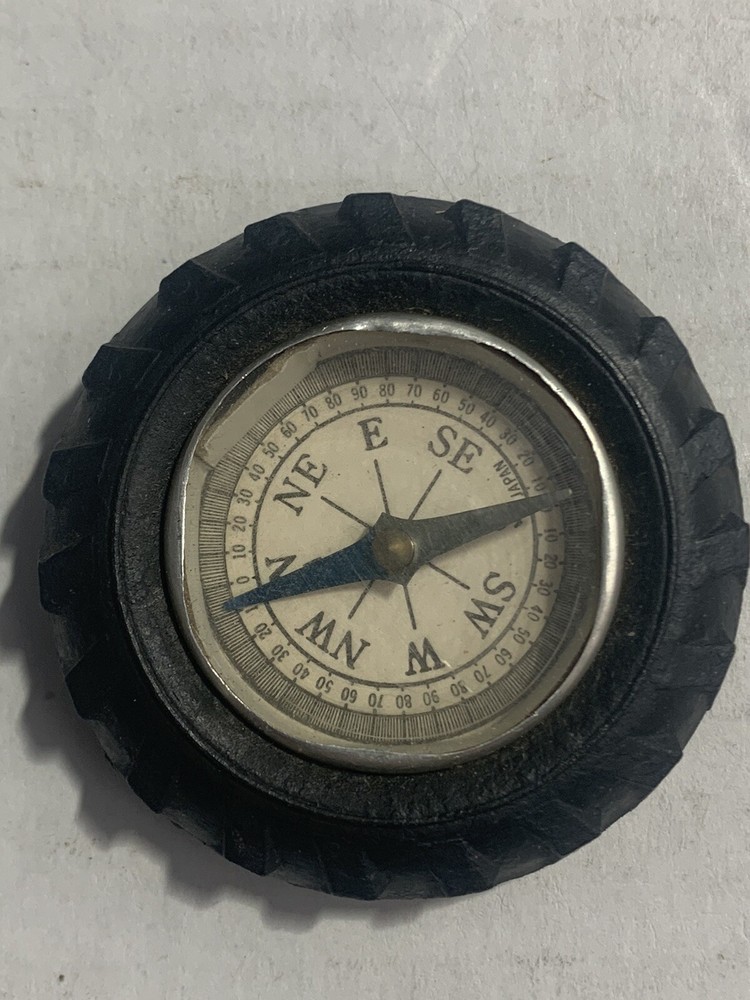 Vintage rubber tire shaped pocket size compass; made in Japan