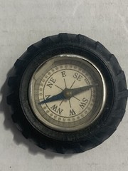 Vintage rubber tire shaped pocket size compass; made in Japan
