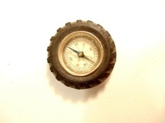 Vintage rubber tire shaped pocket size compass; made in Japan