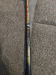 This is a Leki trekking pole featuring a black grip and an adjustable shaft.