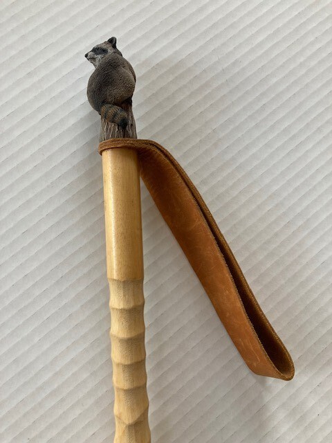 Hardwood walking and treking pole for nature hikes, racoon figurine on top