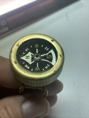 Vintage brass pin on compass