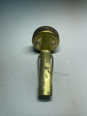 Vintage brass pin on compass