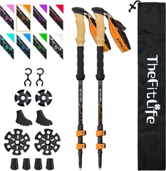 Foldable telescopic trekking poles with cork handles and extended EVA grips.