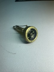 Vintage brass pin on compass
