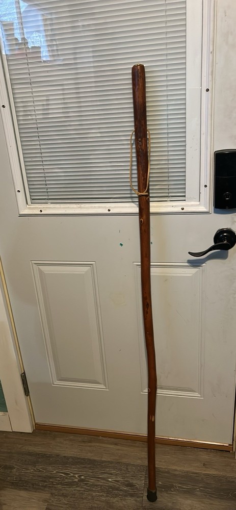 Hand made walking/hiking stick has built in compass at the top.