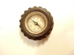 Vintage rubber tire shaped pocket size compass; made in Japan