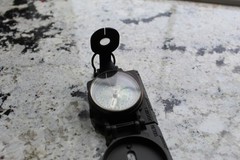 Vintage military compass folds up to compact travel size