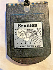 Brunton mirrored sighting compass with declination scale and pouch, made in USA