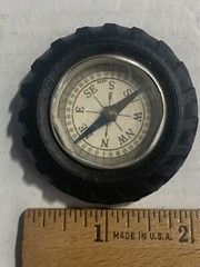 Vintage rubber tire shaped pocket size compass; made in Japan