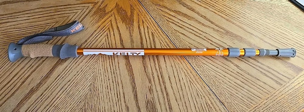 Kelty Metallic Orange Walking Stick Anti Shock System W/ Wrist Strap & Tip Cover