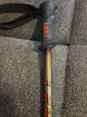 This is a Leki trekking pole featuring a black grip and an adjustable shaft.