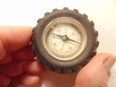Vintage rubber tire shaped pocket size compass; made in Japan