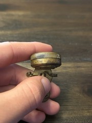 Marble’s Gladstone Michigan brass compass pin back