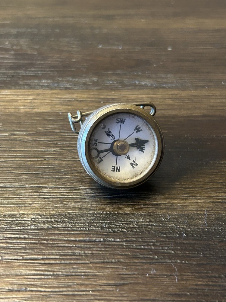 Marble’s Gladstone Michigan brass compass pin back