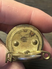 Marble’s Gladstone Michigan brass compass pin back