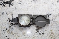Vintage military compass folds up to compact travel size