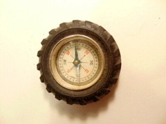Vintage rubber tire shaped pocket size compass; made in Japan