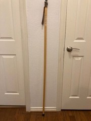 Hardwood walking and treking pole for nature hikes, racoon figurine on top