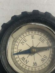 Vintage rubber tire shaped pocket size compass; made in Japan