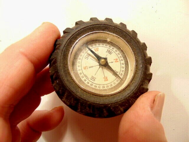 Vintage rubber tire shaped pocket size compass; made in Japan
