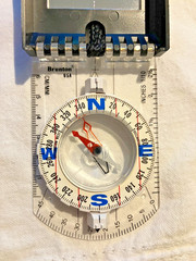 Brunton mirrored sighting compass with declination scale and pouch, made in USA
