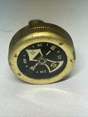 Vintage brass pin on compass